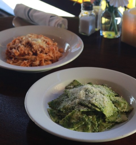 House-made Raviolo stuffed with ricotta and spinach, pesto sauce and parmesan cheese. Also house-made fettuccine with bolognese sauce